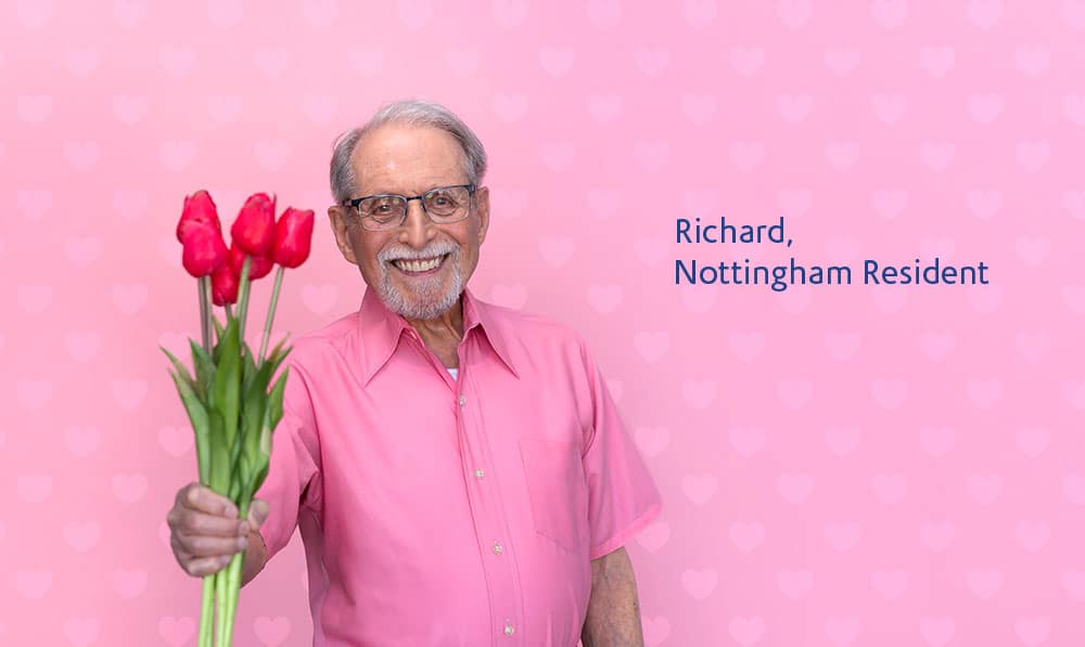 Richard, Nottingham resident holding pink tulips