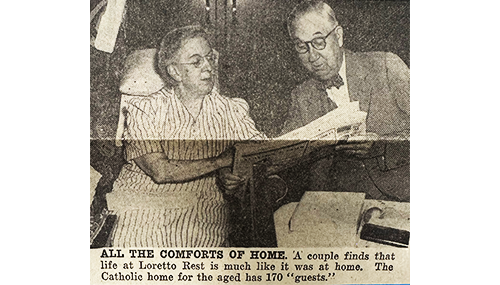 A couple in newspaper at Loretto Rest