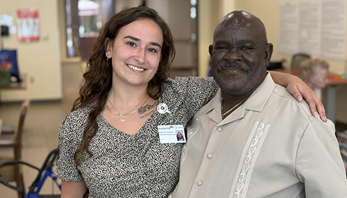 Pace employee hugging and smiling with pace participant